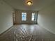 Large bedroom with carpet and two windows at 2114 Stillhaven Pl, Douglasville, GA 30135