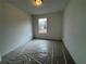 Bright bedroom with carpet and a window at 2114 Stillhaven Pl, Douglasville, GA 30135