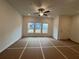 Bright living room with large windows and ceiling fan at 2114 Stillhaven Pl, Douglasville, GA 30135