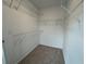 Large walk-in closet with wire shelving; providing ample storage at 2114 Stillhaven Pl, Douglasville, GA 30135