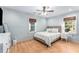 Spacious bedroom with hardwood floors, ceiling fan, and large windows at 2662 Memorial Se Dr, Atlanta, GA 30317