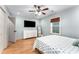 Light and airy bedroom with hardwood floors and ceiling fan at 2662 Memorial Se Dr, Atlanta, GA 30317