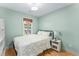 Charming bedroom with a comfortable bed and built-in shelving at 2662 Memorial Se Dr, Atlanta, GA 30317