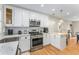 Modern kitchen featuring stainless steel appliances and white cabinetry at 2662 Memorial Se Dr, Atlanta, GA 30317