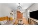 Cozy living room with exposed brick wall and hardwood floors at 2662 Memorial Se Dr, Atlanta, GA 30317