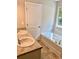 Bathroom with double vanity, garden tub, and tile flooring at 478 Charleston Pl, Villa Rica, GA 30180