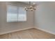 Bright dining room with hardwood floors and elegant chandelier at 4822 Floydwood Ln, Mableton, GA 30126