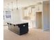 Kitchen with dark island and white cabinets at 4822 Floydwood Ln, Mableton, GA 30126