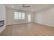 Living room with hardwood floors, ceiling fan, and sliding glass doors at 4822 Floydwood Ln, Mableton, GA 30126