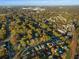 Aerial view of a neighborhood showcasing houses surrounded by lush autumn foliage at 627 Mead Se St, Atlanta, GA 30312