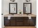 Double vanity bathroom with dark brown cabinets and a beige countertop at 627 Mead Se St, Atlanta, GA 30312