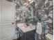 Stylish powder room with palm tree wallpaper, grey vanity and white countertop at 627 Mead Se St, Atlanta, GA 30312