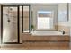 Elegant bathroom featuring a soaking tub and walk-in shower at 627 Mead Se St, Atlanta, GA 30312