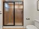 Modern bathroom with a large glass shower and neutral tile at 627 Mead Se St, Atlanta, GA 30312