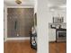 Bright entryway with dark patterned wall, hardwood floors, and view into kitchen at 627 Mead Se St, Atlanta, GA 30312