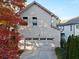 House exterior with gray siding, double garage doors, and autumn leaves at 627 Mead Se St, Atlanta, GA 30312