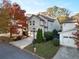 Two-story home with detached garage and autumn landscaping at 627 Mead Se St, Atlanta, GA 30312