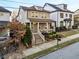 Two-story home on tree lined street with brick front steps at 627 Mead Se St, Atlanta, GA 30312