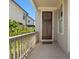 Front porch with wood door and simple welcome mat at 627 Mead Se St, Atlanta, GA 30312