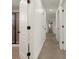 Bright hallway with neutral walls and carpet, connecting bedrooms and bathroom at 627 Mead Se St, Atlanta, GA 30312