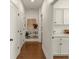 Bright hallway with built-in shelves and hardwood floors at 627 Mead Se St, Atlanta, GA 30312