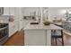 Modern kitchen with white cabinets, quartz countertops and stainless steel appliances at 627 Mead Se St, Atlanta, GA 30312