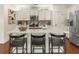 Large kitchen island with seating, quartz countertops, and modern fixtures at 627 Mead Se St, Atlanta, GA 30312