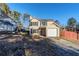 Tan two-story house with attached garage and fenced backyard at 3727 Conley Downs Ln, Decatur, GA 30034