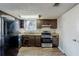 Full view of kitchen with appliances and wood-look flooring at 3727 Conley Downs Ln, Decatur, GA 30034