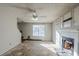 Living room with fireplace and ceiling fan at 3727 Conley Downs Ln, Decatur, GA 30034