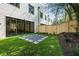Small backyard with artificial turf and a flagstone patio area at 622 Bellemeade Nw Ave # 9, Atlanta, GA 30318