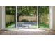 View of backyard through sliding glass doors at 622 Bellemeade Nw Ave # 9, Atlanta, GA 30318