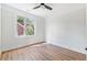 Well-lit bedroom with wood floors and window at 622 Bellemeade Nw Ave # 9, Atlanta, GA 30318