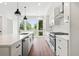 Bright kitchen featuring white cabinetry, quartz countertops, and stainless steel appliances at 622 Bellemeade Nw Ave # 9, Atlanta, GA 30318