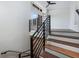 Modern staircase with metal railing leading to upper level at 622 Bellemeade Nw Ave # 9, Atlanta, GA 30318