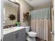 Updated bathroom with gray vanity and neutral decor at 644 Holland Rd, Dallas, GA 30157