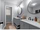 Modern bathroom with double vanity and large mirrors at 185 Bob White Dr, Stockbridge, GA 30281