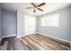 Well-lit bedroom with hardwood floors and double doors to closet at 207 Okemah Se Trl, Marietta, GA 30060