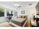 Bright bedroom with large windows, built-in shelving and desk at 403 Pratt Se Dr # 1009, Atlanta, GA 30315