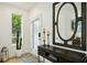 Bright entryway with large mirror, console table, and cactus plant at 403 Pratt Se Dr # 1009, Atlanta, GA 30315