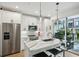 Modern kitchen with white cabinets, marble countertops, and island at 403 Pratt Se Dr # 1009, Atlanta, GA 30315
