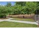 Landscaped area with a sidewalk and trees at 403 Pratt Se Dr # 1009, Atlanta, GA 30315