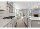 Modern kitchen with gas range and white cabinets at 57 Rocking Wood Vw, Dallas, GA 30157