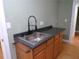 Functional laundry room with sink, cabinets, and a convenient workspace at 1616 Oleander Sw Dr, Lilburn, GA 30047