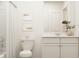 Simple bathroom with white vanity, toilet, and shower/tub combo at 2803 Habibi Ct, Buford, GA 30519