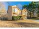 Tan house with double garage and wood stairs at 2895 Ivy Mill Dr, Buford, GA 30519