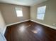 Bright bedroom with hardwood floors and large window at 1294 N Avenue Nw, Atlanta, GA 30318