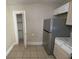 Kitchen features stainless steel refrigerator and pantry at 1294 N Avenue Nw, Atlanta, GA 30318