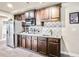 Basement wet bar with granite countertops and cabinetry at 2336 Morgan Estate Dr, Buford, GA 30519