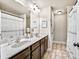 Clean bathroom with double sinks and a large mirror at 2336 Morgan Estate Dr, Buford, GA 30519